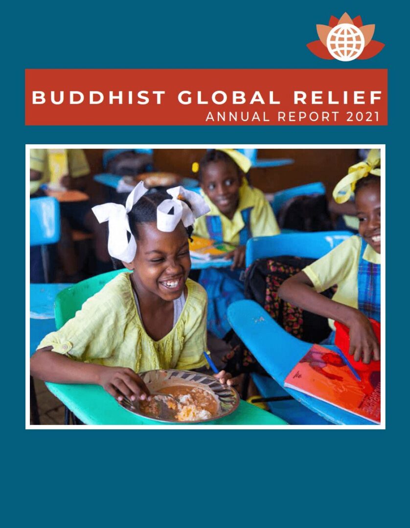 Children happily eating meals in a classroom setting supported by Buddhist Global Relief.