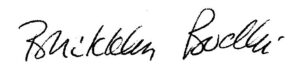 Close-up of black handwritten signatures on white paper.