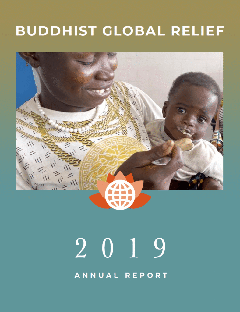 Mother feeding her child, symbolizing care and nutrition in 2019.